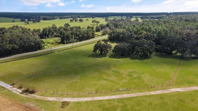 birds eye view of property featuring a rural view