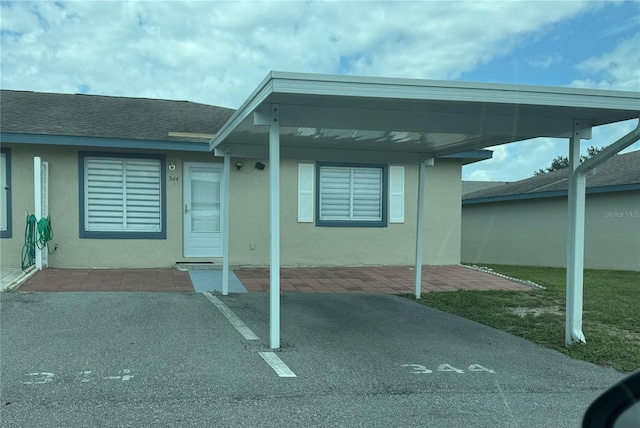 exterior space with a carport