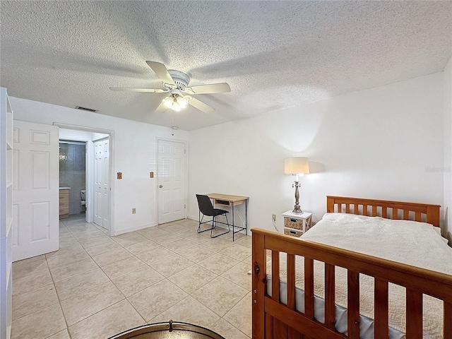 bedroom with light tile patterned flooring, a textured ceiling, and ceiling fan