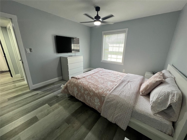 bedroom with ceiling fan and hardwood / wood-style flooring