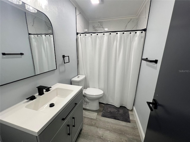 bathroom featuring a shower with shower curtain, hardwood / wood-style flooring, vanity, and toilet