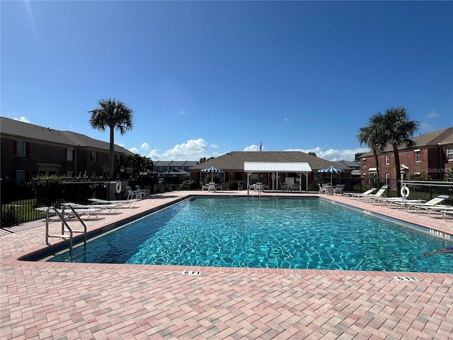 view of swimming pool featuring a patio area