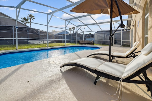 view of pool featuring a lanai and a patio