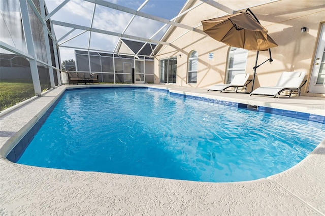 view of pool featuring a lanai and a patio