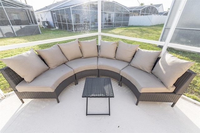 view of patio featuring outdoor lounge area and glass enclosure