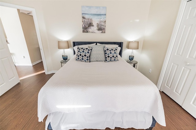 bedroom featuring a closet and hardwood / wood-style flooring