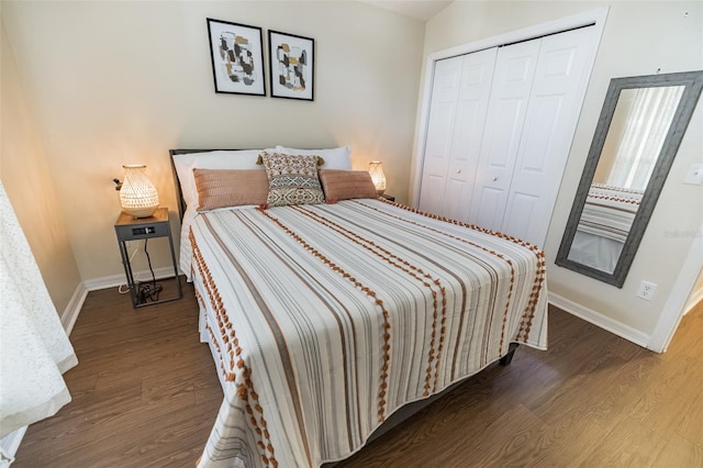 bedroom with a closet and hardwood / wood-style flooring