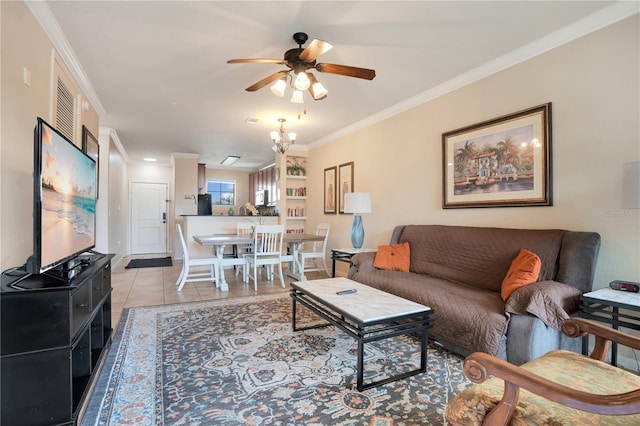 tiled living room with ceiling fan with notable chandelier and ornamental molding