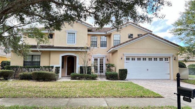 view of front of home with a garage and a front yard