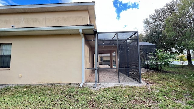 view of side of property with a lawn