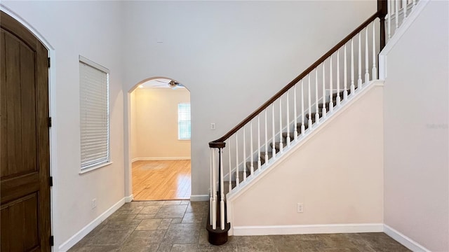 foyer with dark wood-type flooring and ceiling fan