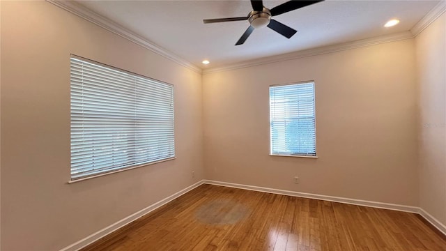 spare room featuring hardwood / wood-style flooring, ceiling fan, and ornamental molding