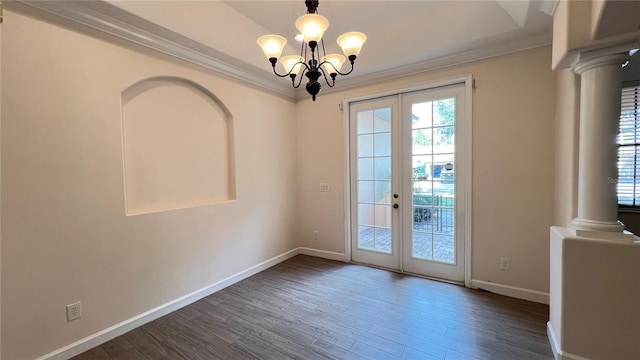 doorway featuring ornamental molding, french doors, a notable chandelier, and dark hardwood / wood-style floors