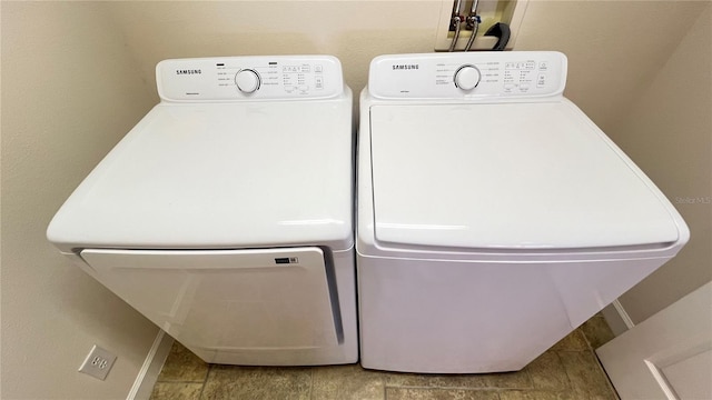 laundry area featuring washing machine and clothes dryer