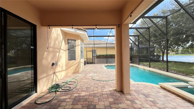 view of pool featuring a lanai and a patio