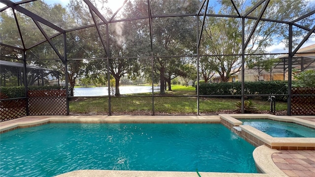 view of pool with a water view, a lanai, and an in ground hot tub