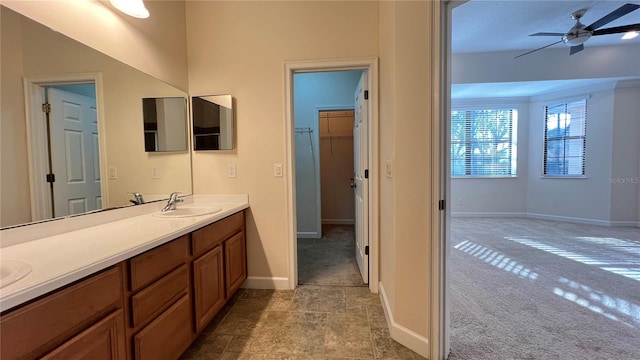 bathroom featuring vanity and ceiling fan