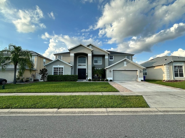 view of front facade with a front yard and a garage