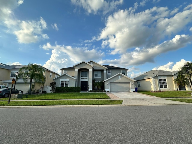 view of front of house featuring a garage and a front lawn