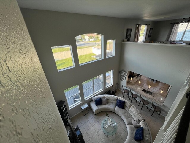 2321 Hinsdale Dr, Kissimmee, FL 34741 - tiled living room with a high ceiling