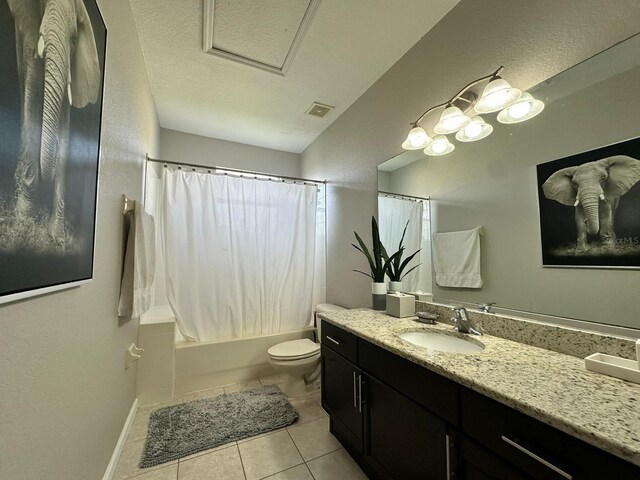 2321 Hinsdale Dr, Kissimmee, FL 34741 - bathroom featuring vanity, shower / tub combo, tile patterned floors, and a textured ceiling