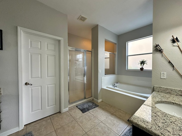 bathroom featuring vanity, plus walk in shower, and tile patterned floors