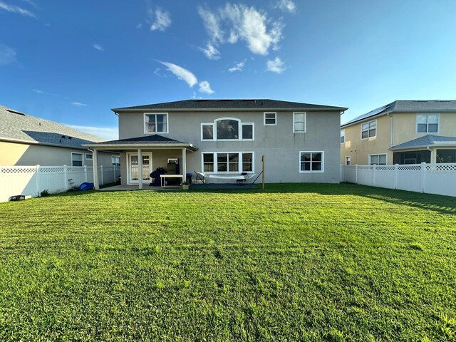 2321 Hinsdale Dr, Kissimmee, FL 34741 - back of house featuring a fenced backyard and stucco siding