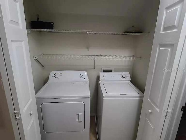 washroom with washer and clothes dryer