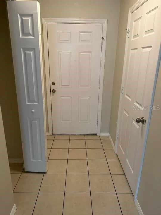 entryway featuring light tile patterned flooring