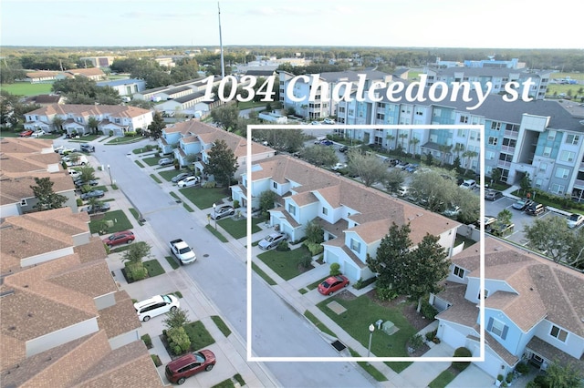 birds eye view of property with a residential view