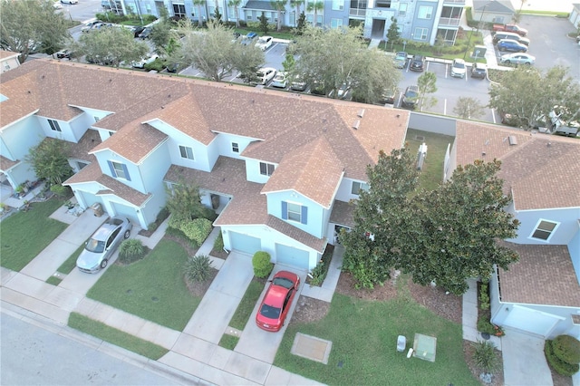 birds eye view of property with a residential view