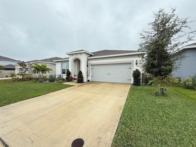 ranch-style home featuring a garage and a front lawn