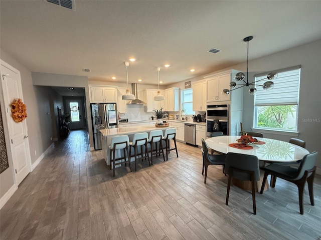 dining room with wood-type flooring and sink