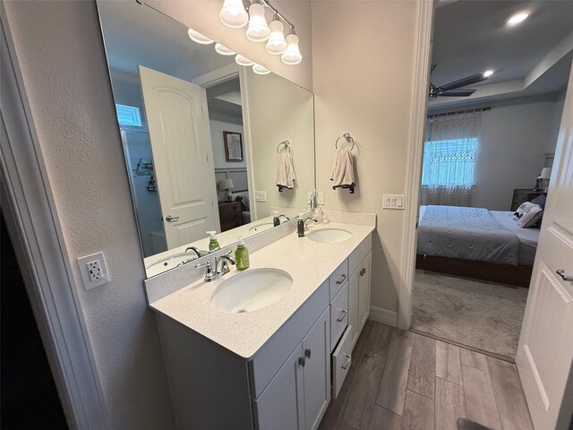 bathroom featuring hardwood / wood-style flooring and vanity