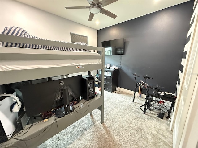 bedroom featuring ceiling fan and light carpet