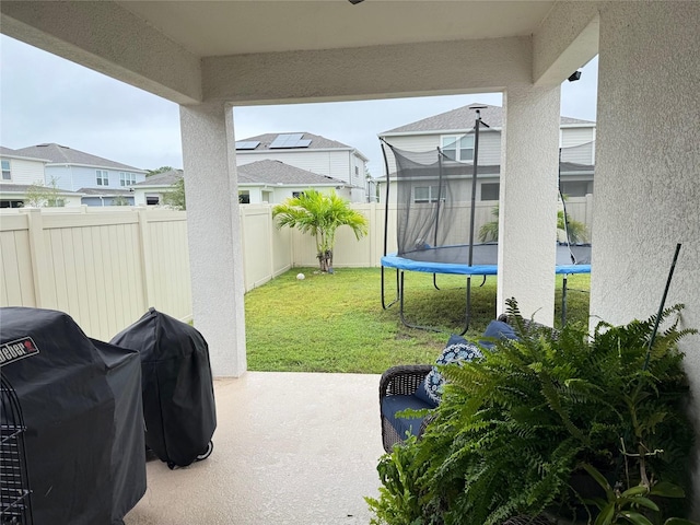 view of patio / terrace featuring grilling area and a trampoline