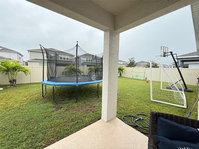 view of yard with a trampoline