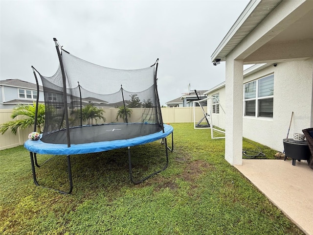 view of yard featuring a trampoline