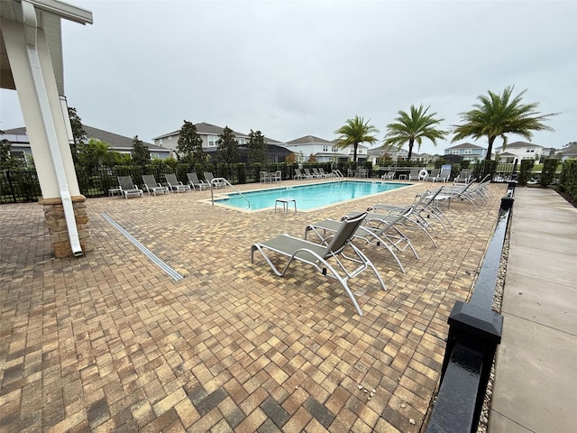 view of swimming pool with a patio area