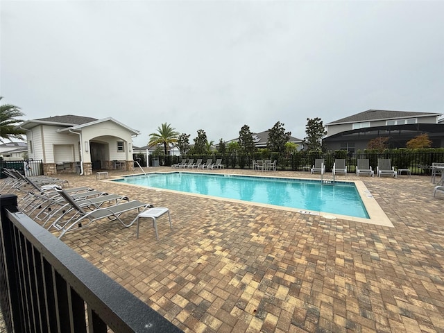 view of swimming pool with a patio area