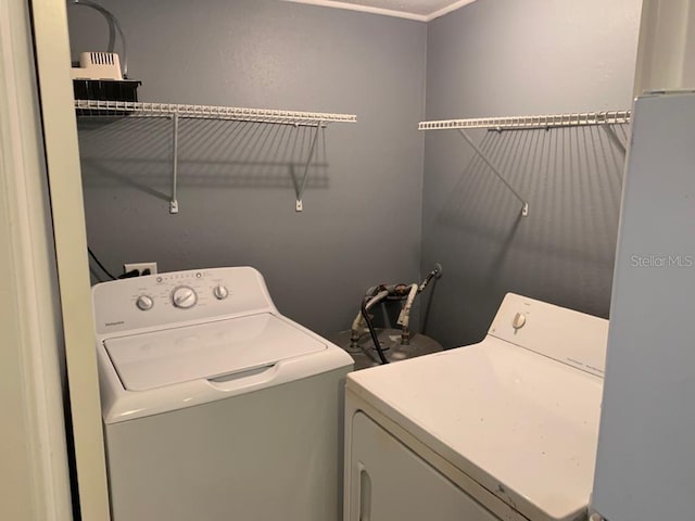 laundry area with separate washer and dryer