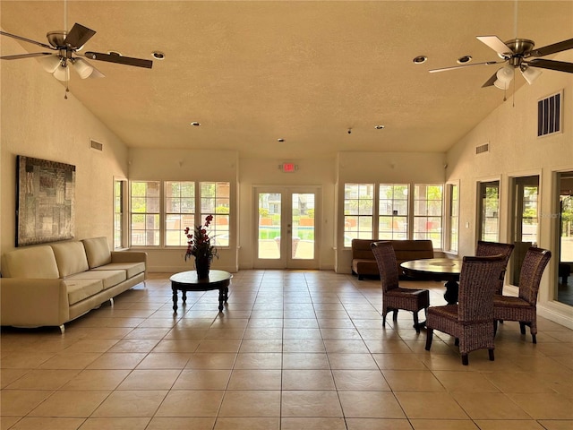 sunroom featuring ceiling fan and lofted ceiling