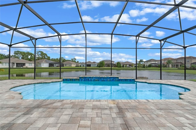 view of swimming pool with a water view, a patio, and glass enclosure