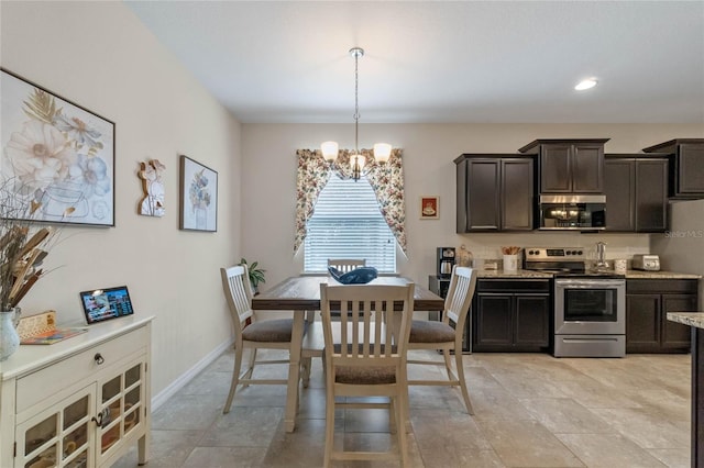 dining space featuring an inviting chandelier