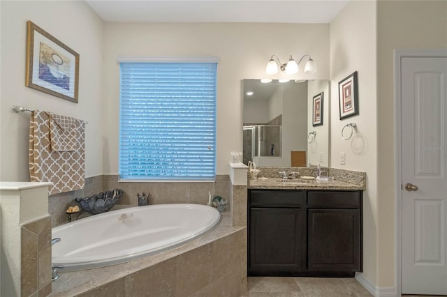 bathroom with vanity, shower with separate bathtub, and plenty of natural light