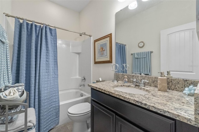 full bathroom featuring shower / bath combination with curtain, vanity, tile patterned flooring, and toilet