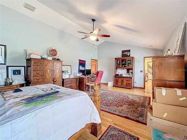 bedroom with lofted ceiling, ceiling fan, and light hardwood / wood-style floors