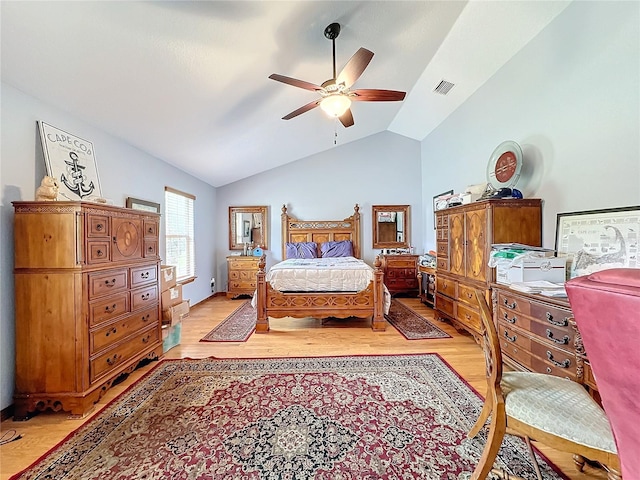 bedroom with lofted ceiling, ceiling fan, and light hardwood / wood-style floors