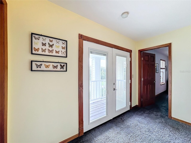 doorway featuring french doors and dark carpet