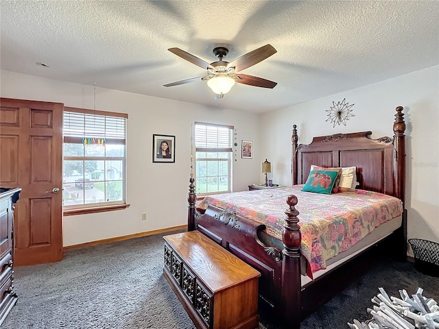 carpeted bedroom with ceiling fan and a textured ceiling